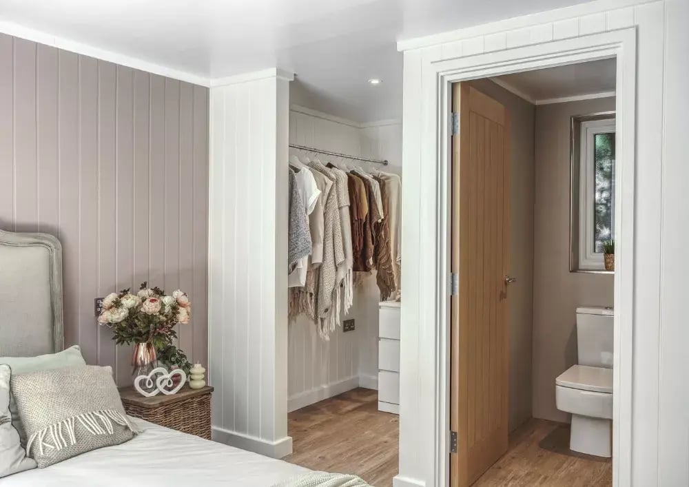 inside a garden room annexe bedroom with walk in wardrobe