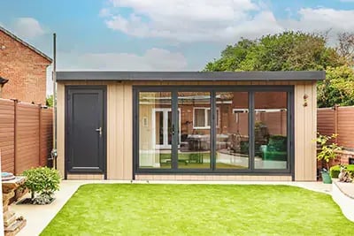 Zero maintenance garden office shed with cupboard and bifolds