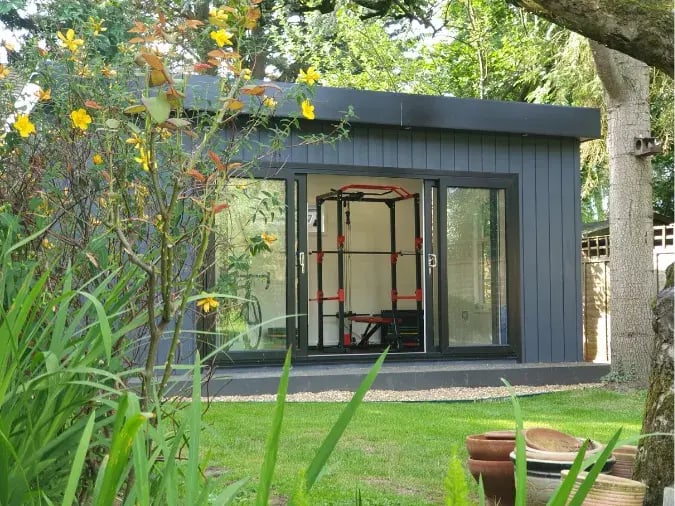 Dark grey composite garden room 