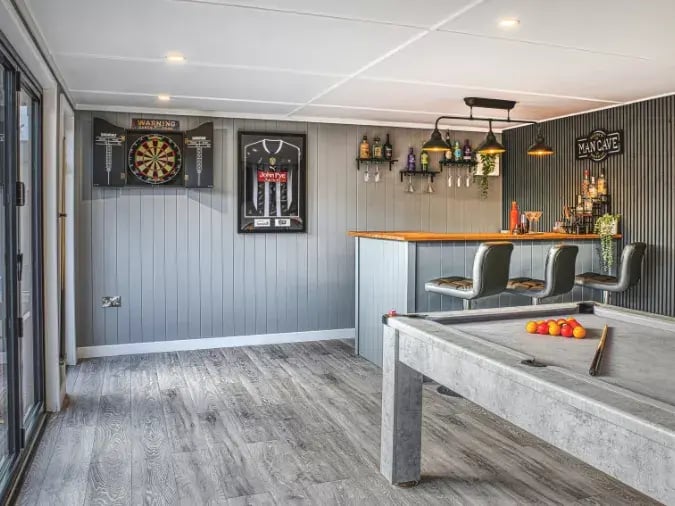 notts county themed garden bar with dart board and pool table