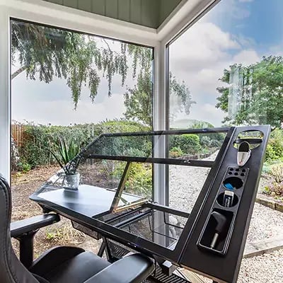 Interior of a small office cabin with architect's easel