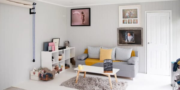 Interior of a garden photo studio with lighting equipment, backdrop and props 