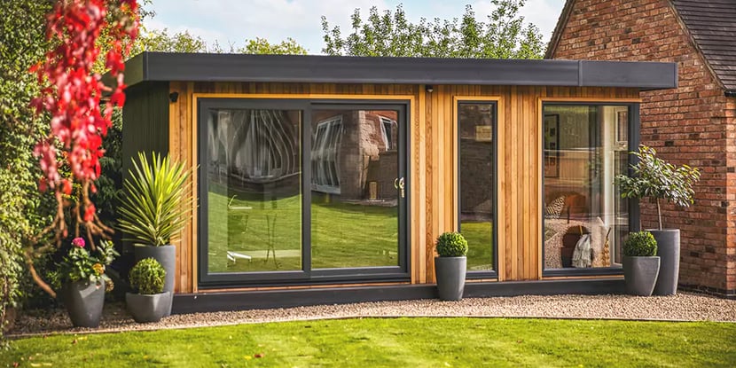 Wooden garden room with sliding doors