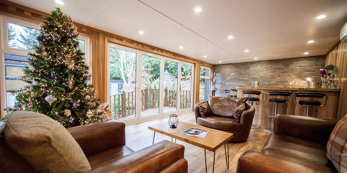 cabin master garden room with christmas tree and christmas decorations 