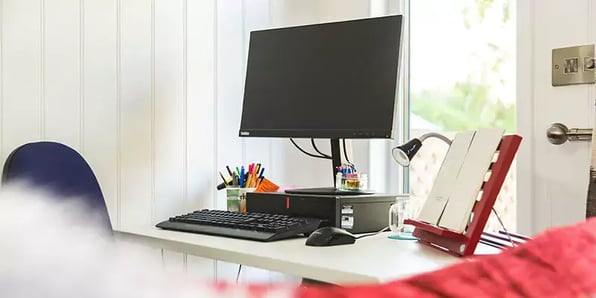 inside a garden office close up of desk with computer screen