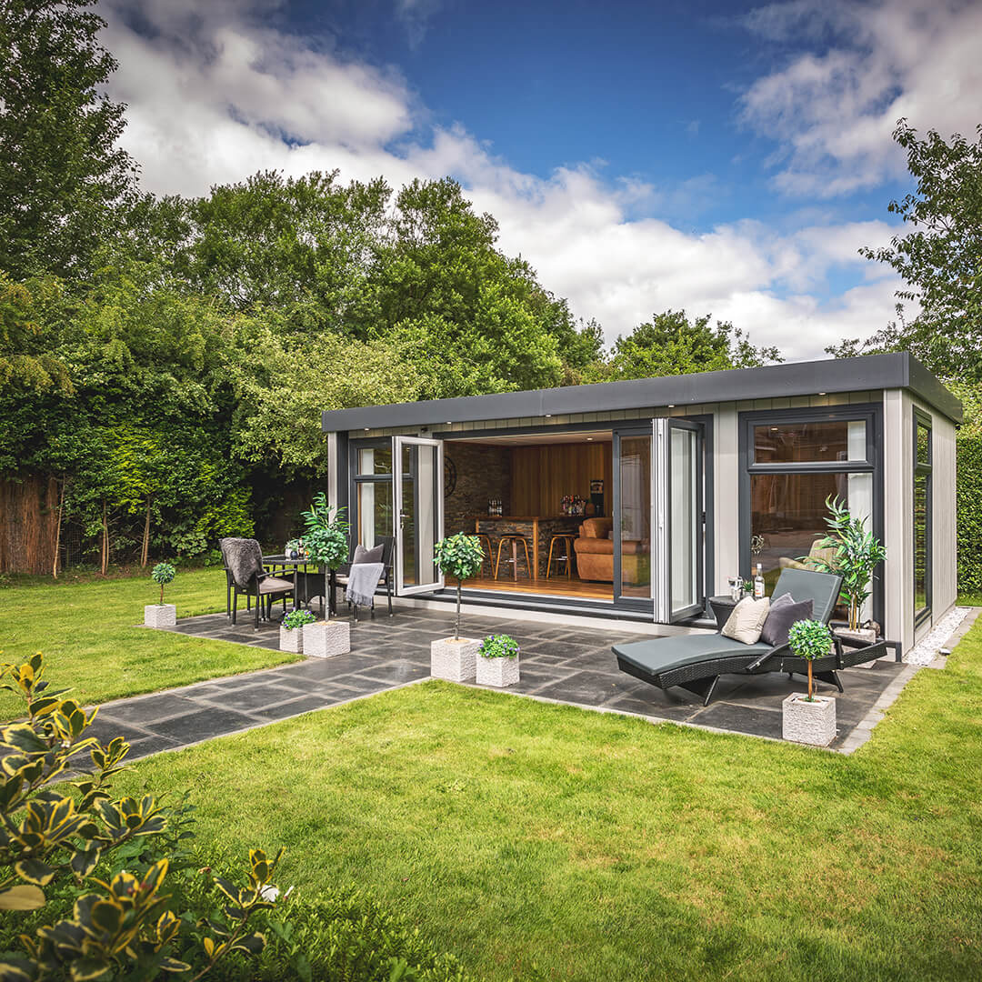 marley garden bar timber building with a lawn area and a walkway leading to it