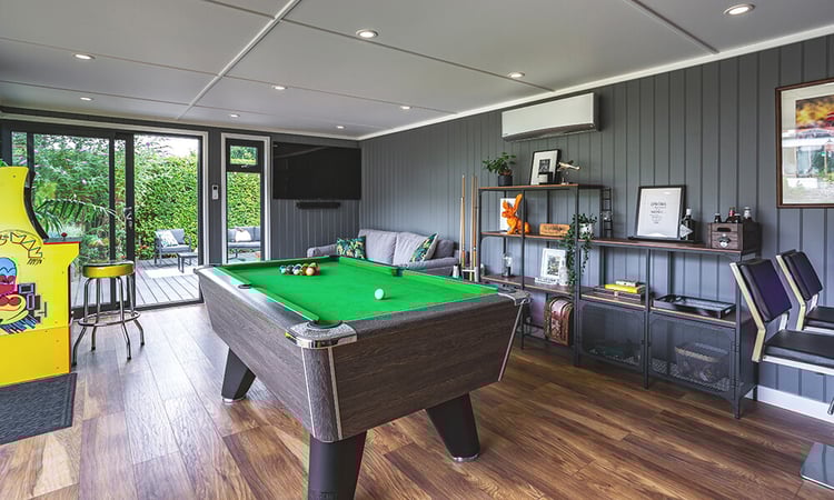 Interior of a garden man cave summerhouse with pool table