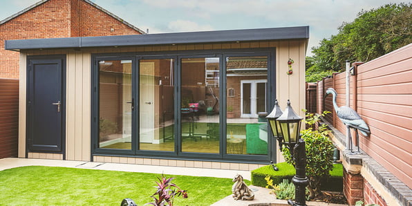 External shot of a large bespoke garden office pod with shed storage 