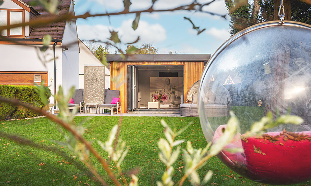 Luxury cedar garden spa room with open bifold doors
