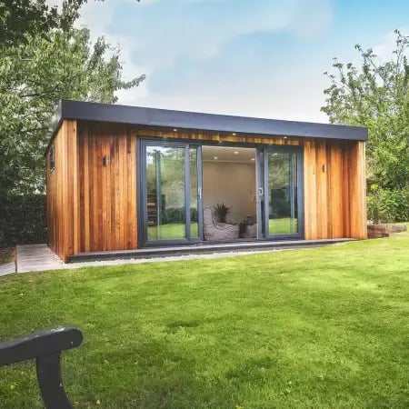 large home gym building in a garden