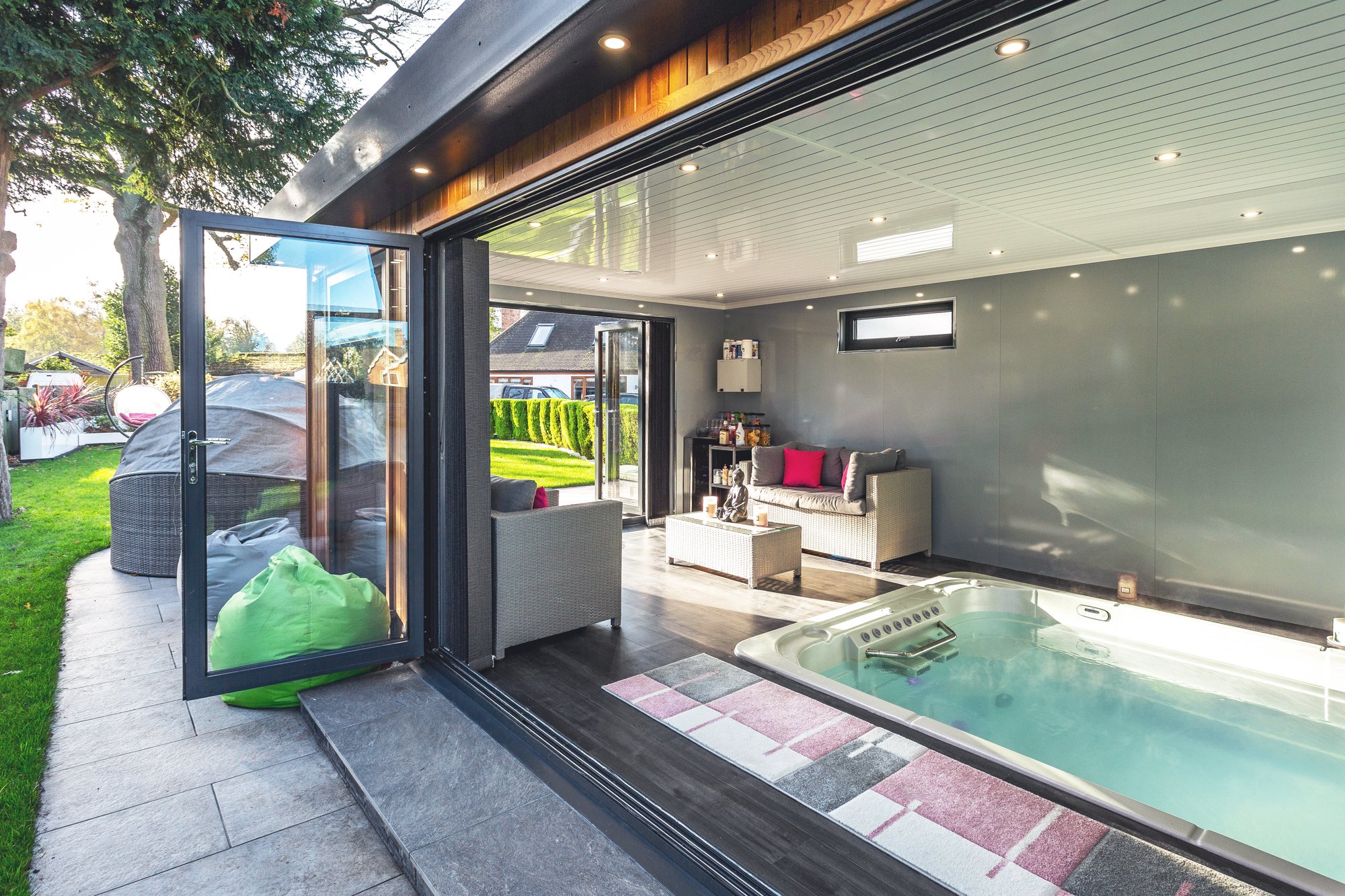 Large swim spa garden room with bifold doors 