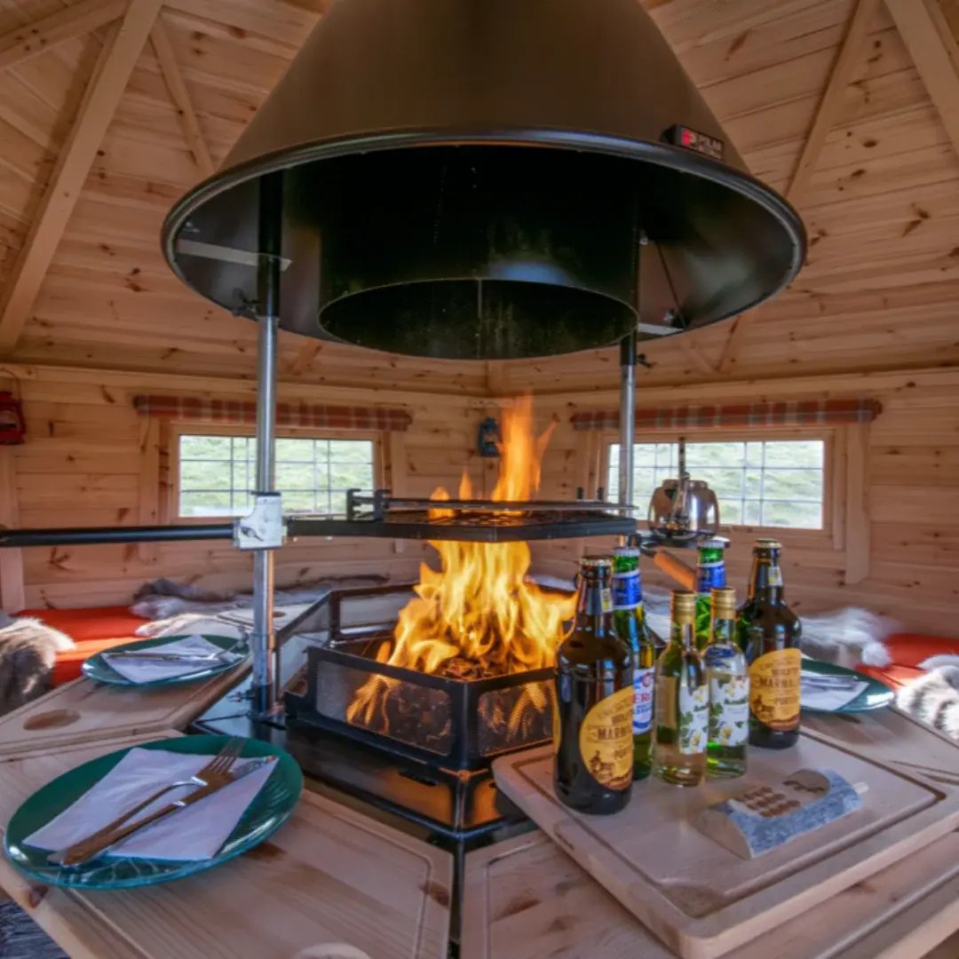 inside a bbq cabin with roaring fire