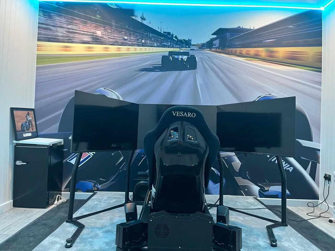 race track graphic feature wall behind racing simulator