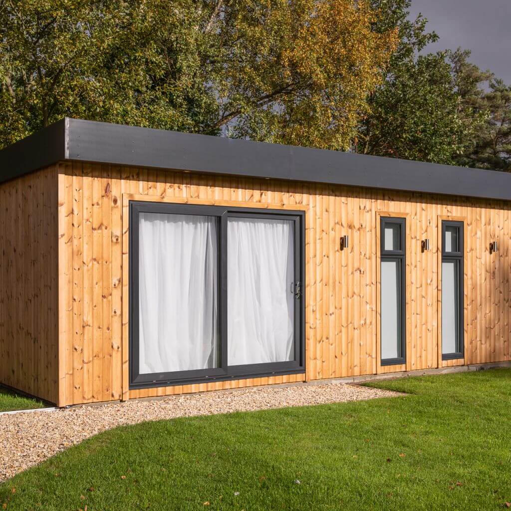 photography studio redwood garden building with large lawn area and gravel walkway