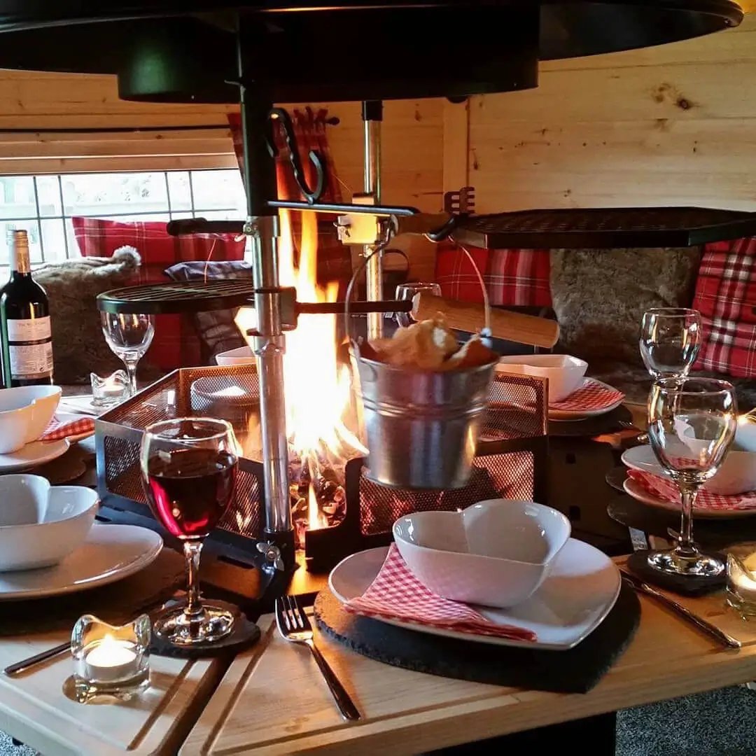 fire lit inside a bbq glamping cabin