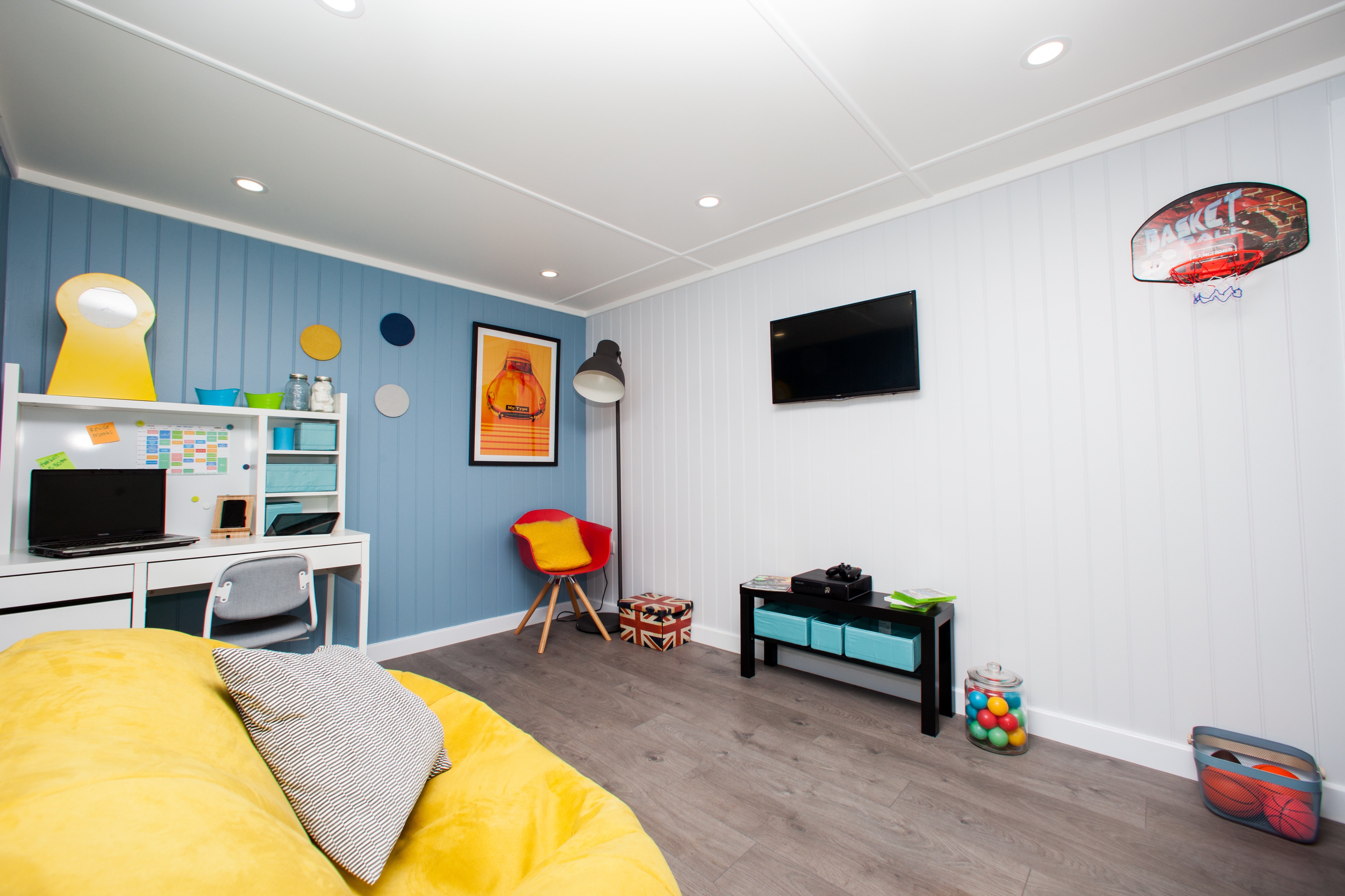 Interior of a garden summerhouse playroom study with fun bright decor