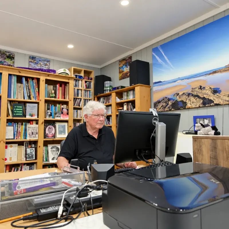 man using his garden writing room