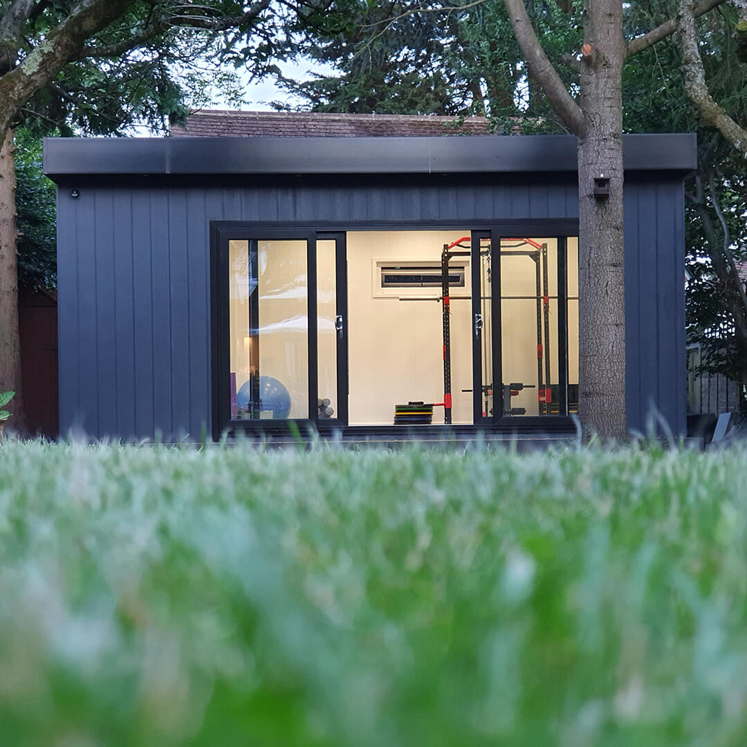 External view of cabin master marley board with sliding doors and exercise equipment 