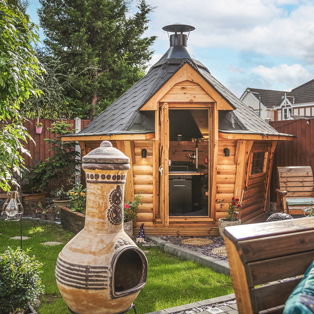 BBQ cabin in small garden with chiminea