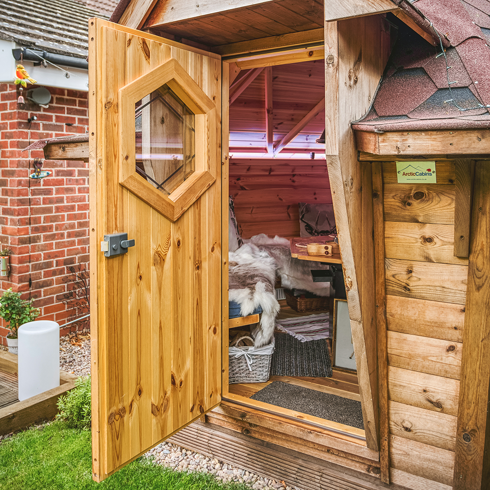 looking in through the door of a bbq cabin