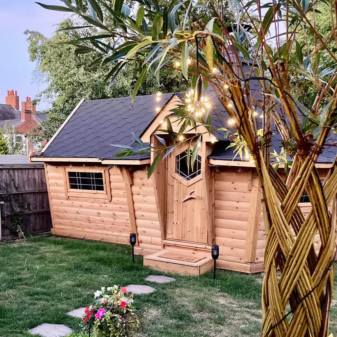 Garden bar BBQ house with twinkly fairy lights outside