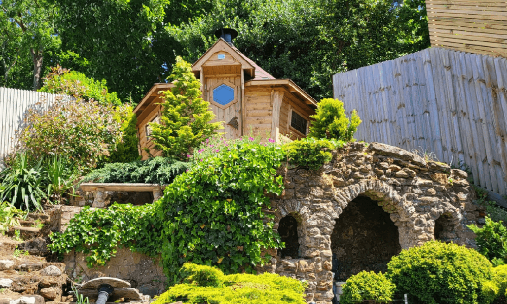 BBQ cabin on old bridge with lots of leafy plants