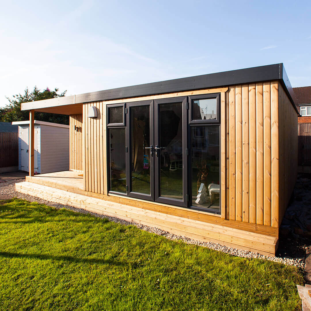 redwood photography studio with lawn area and timber decking with veranda 