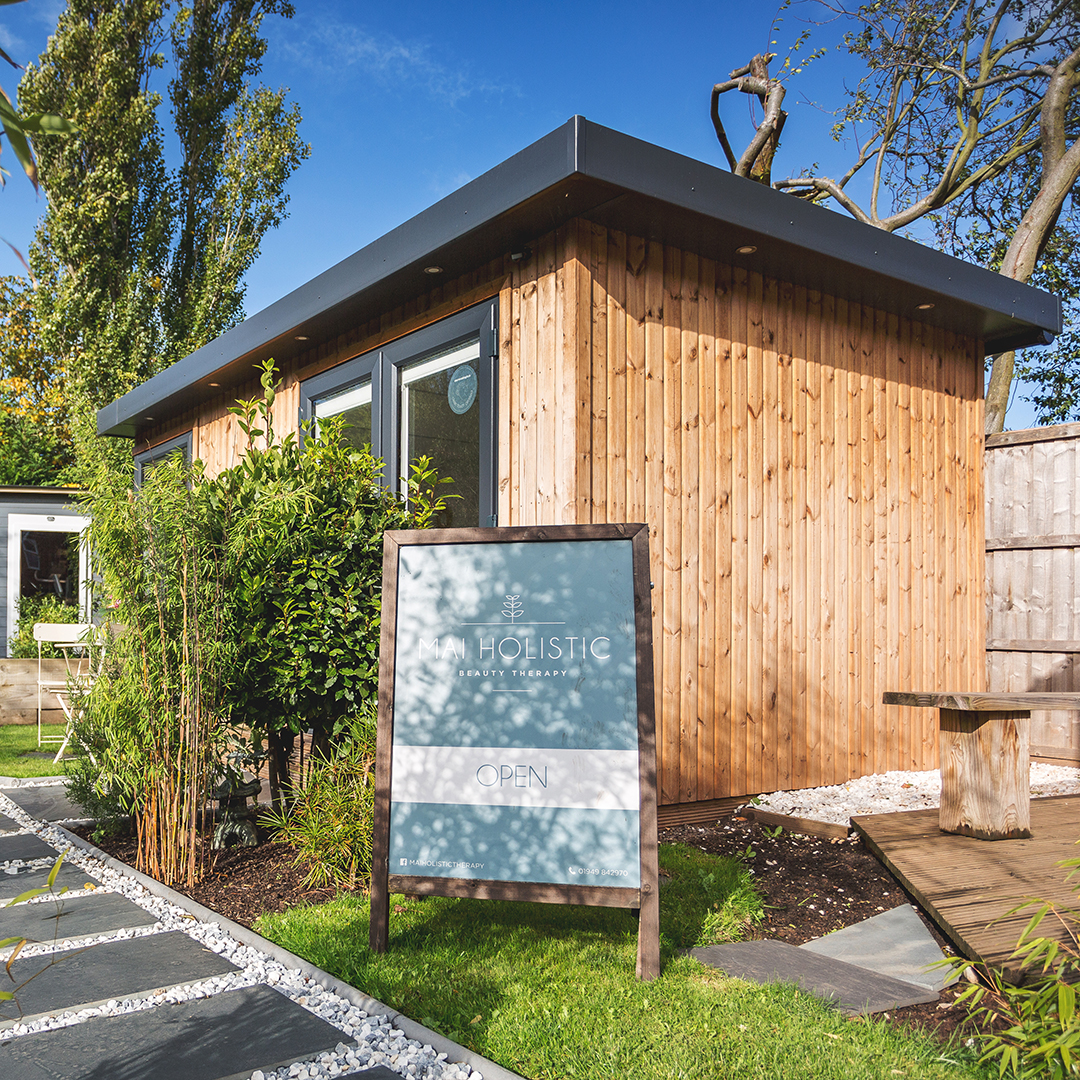 Shot of a garden spa room with a board outside