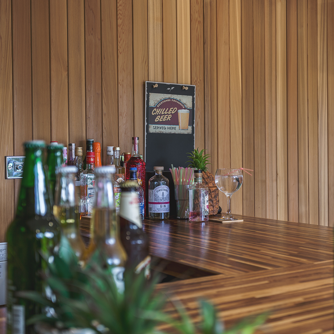 Garden bar interior with drinks & glasses