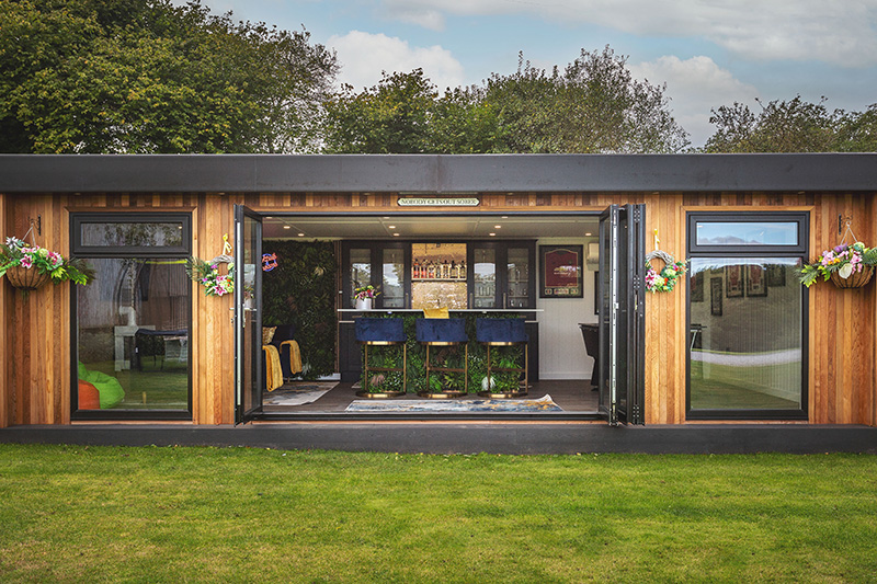 Large garden man cave with bifold doors