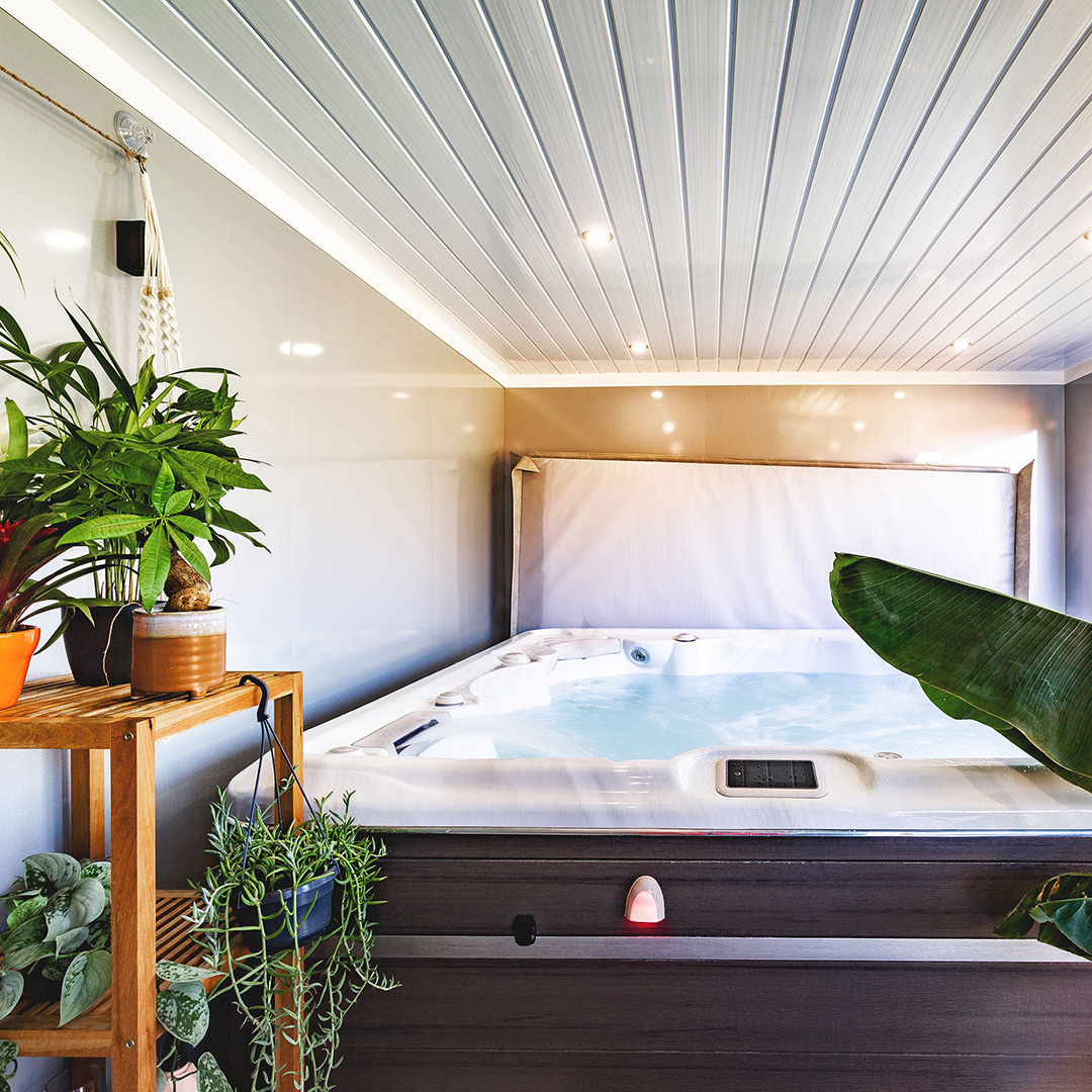 Cabin Master Hydropool Midlands Hot Tub Room internal view with large indoor plants and shower and spotlights in the ceiling