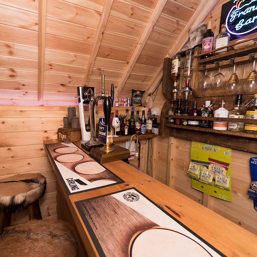 interior close up shot of a redwood drinks rack inside an Arctic Cabin