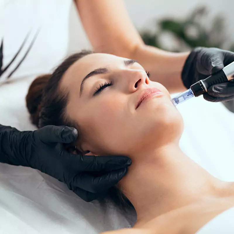 aesthetic practitioner performing facial treatment