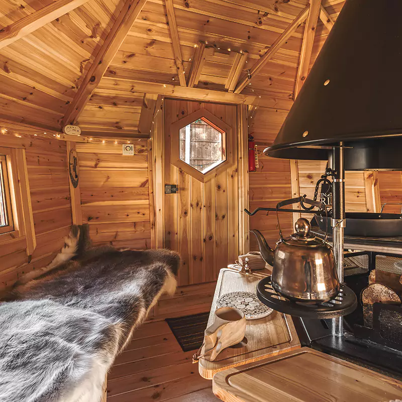 Interior of a BBQ cabin facing towards door