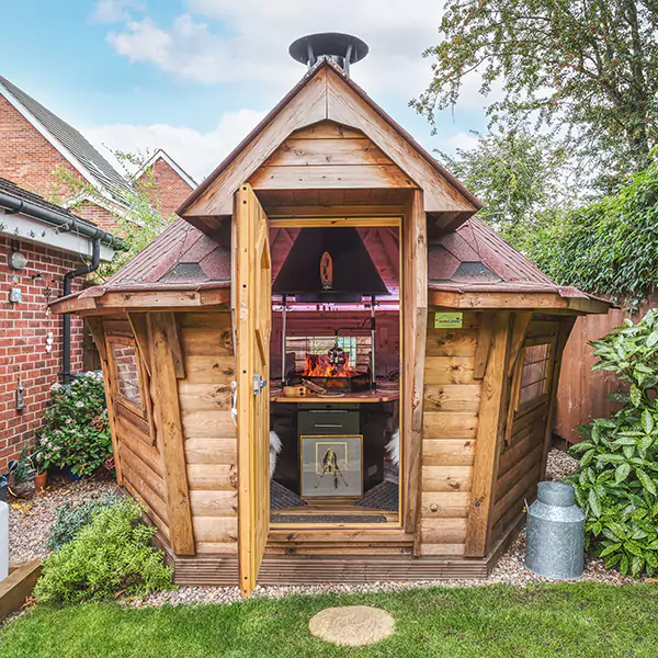 small bbq grilling cabin in modern garden