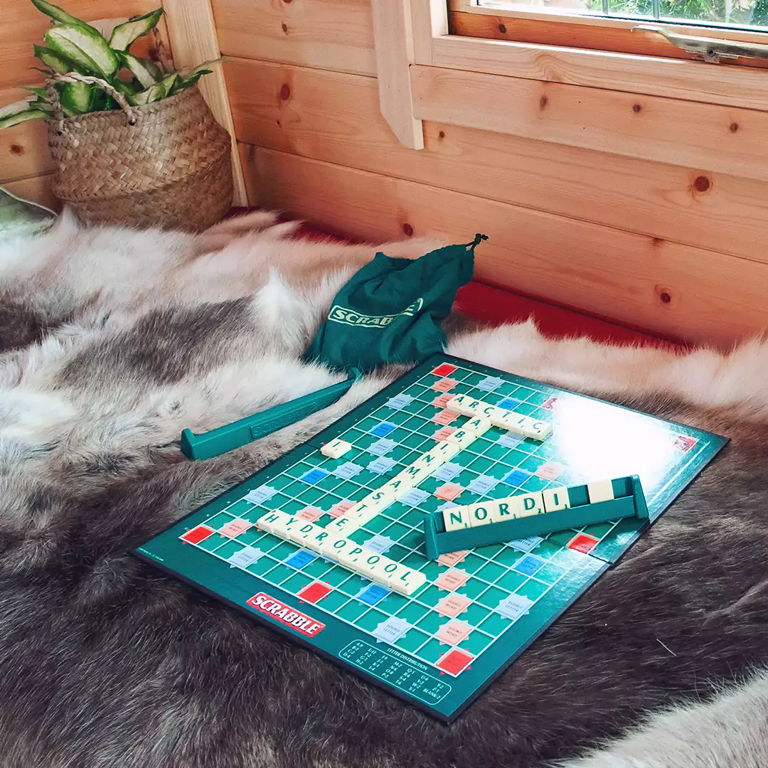 bbq cabin seats with reindeer skins & scrabble board