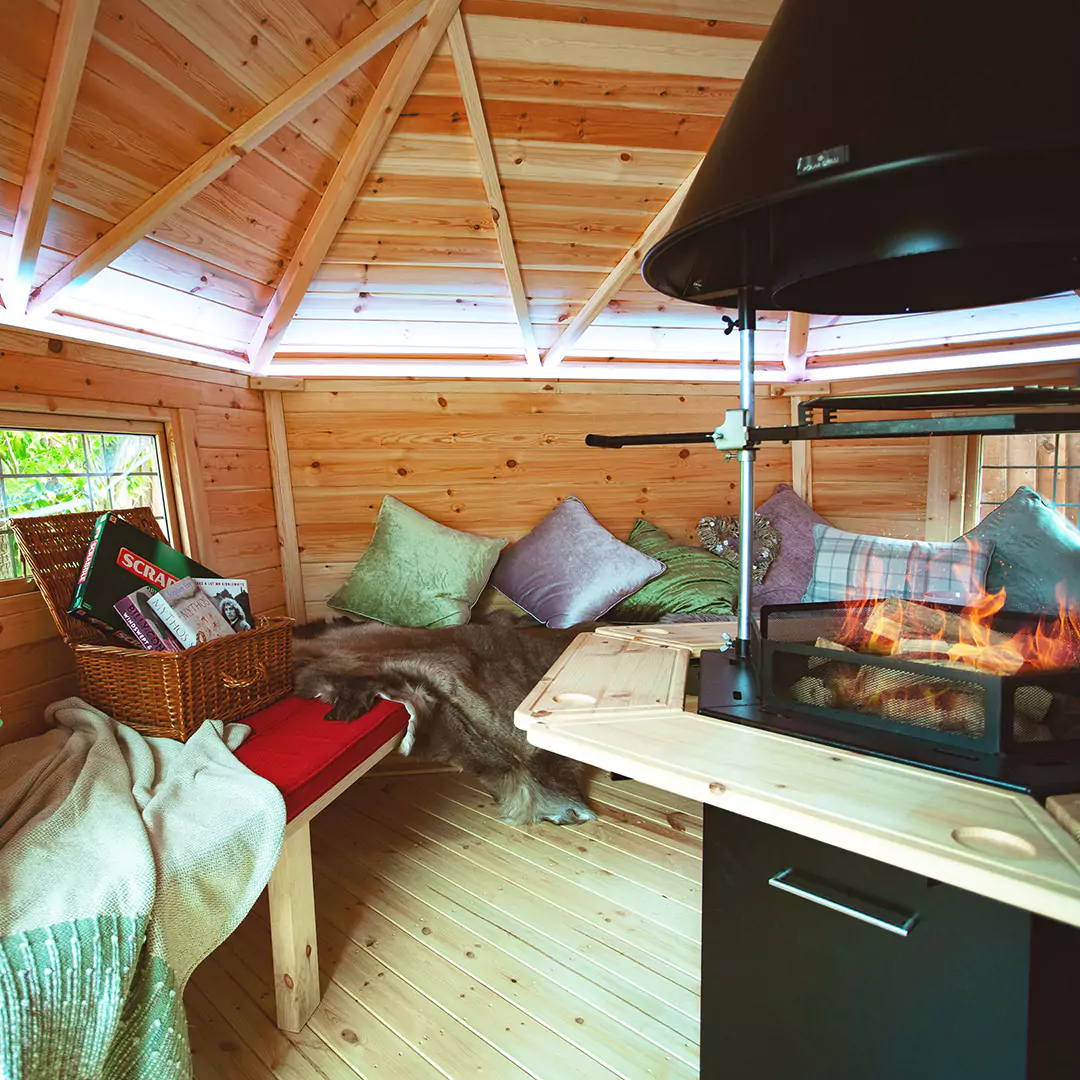 interior of a BBQ cabin with lit fire