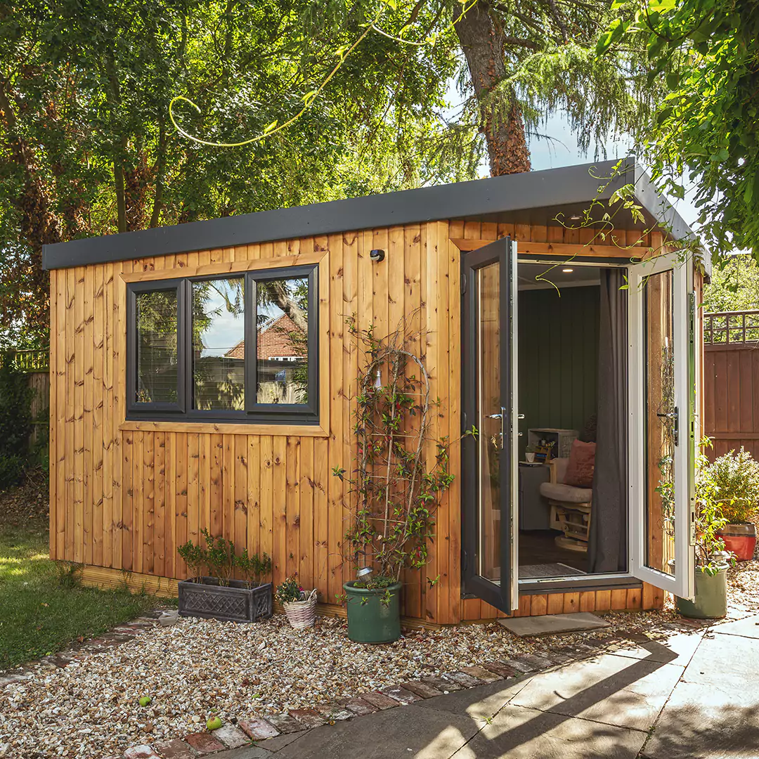 Corner room garden office in redwood with open french doors