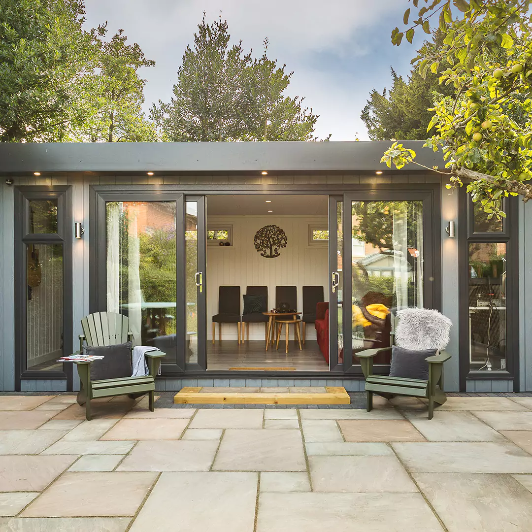 a marley garden bar room with a patio and chairs and a couch in it