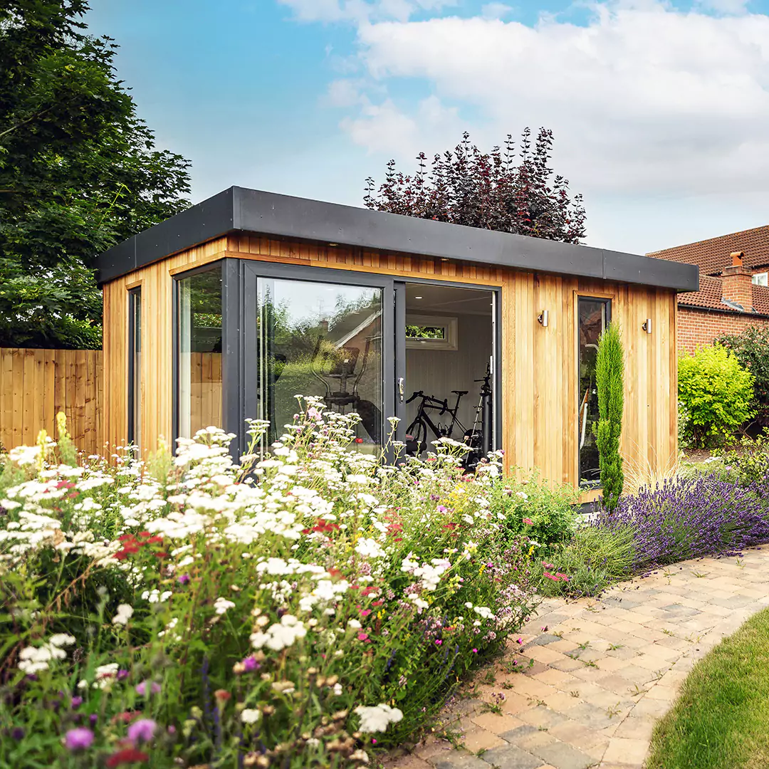 Custom designed gym in garden with lavender bushes and other plants framing shot