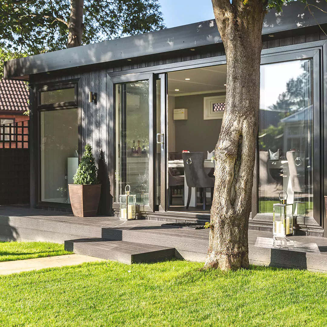 a garden dining building with a large patio and large glass door