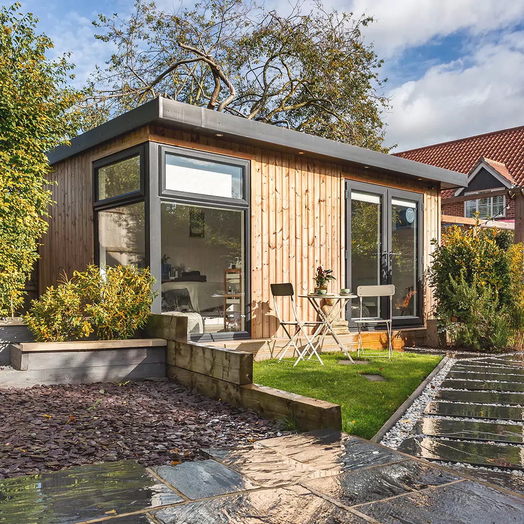 A small home business garden room with a table and chairs