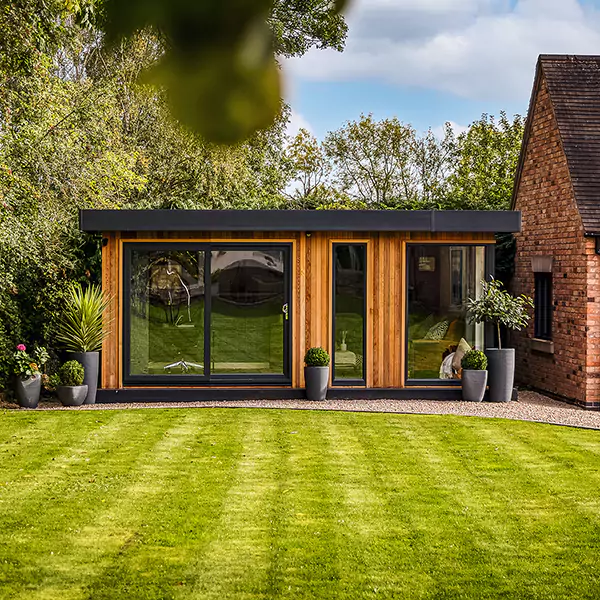Exterior of a luxury garden room office pod with lounge area