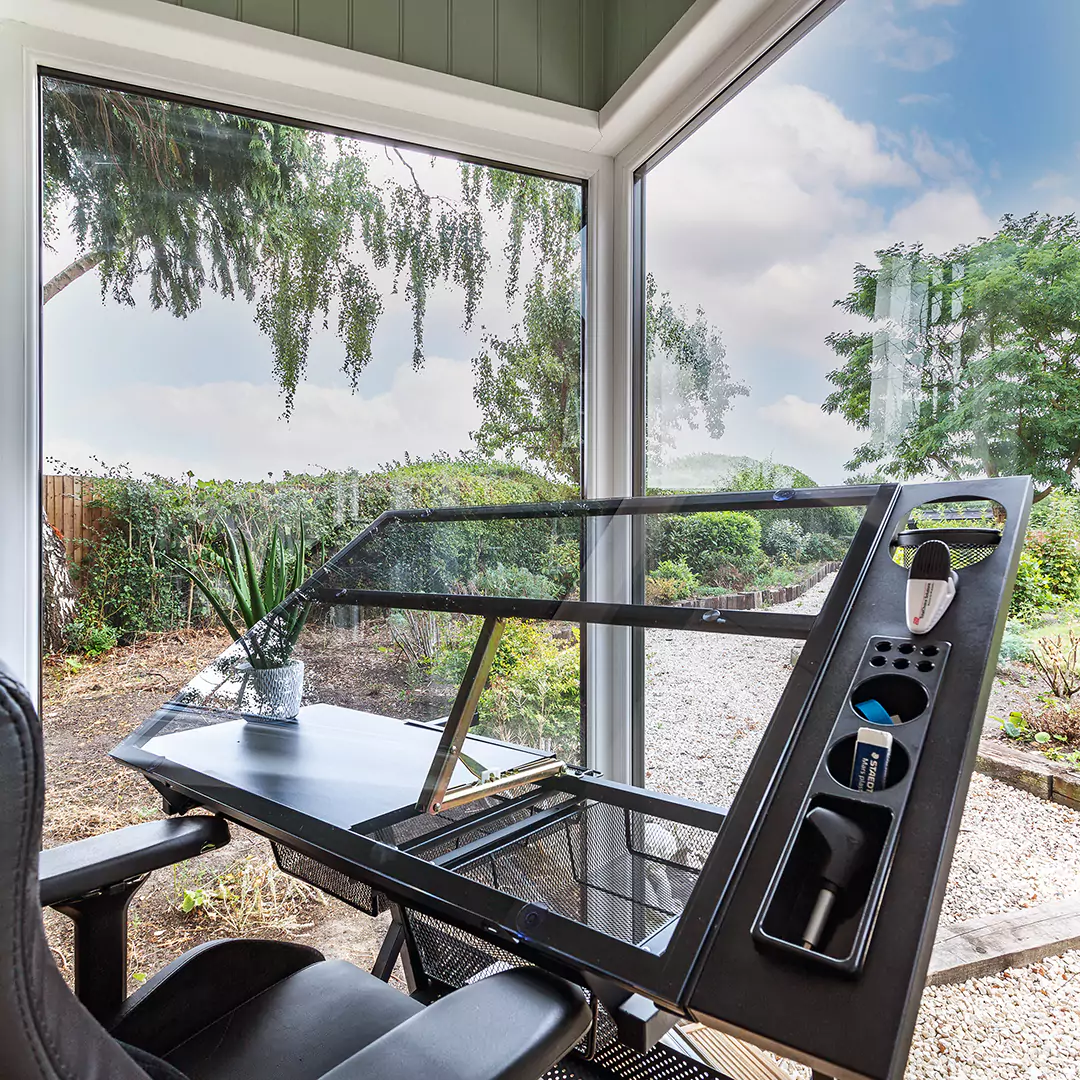 Interior of a small garden office with architect's easel