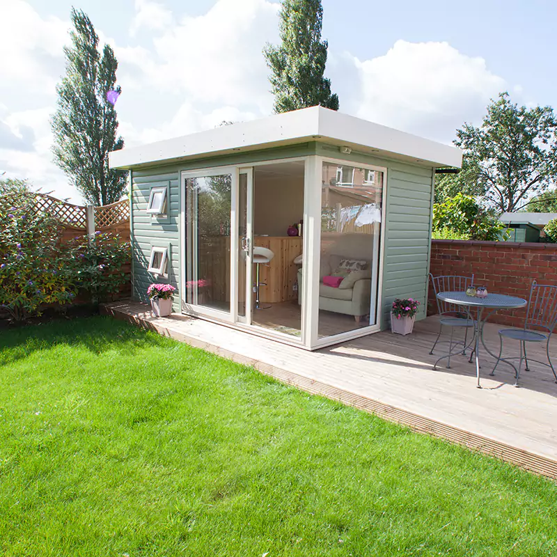 a garden cocktail bar with a table and chairs on patio area 