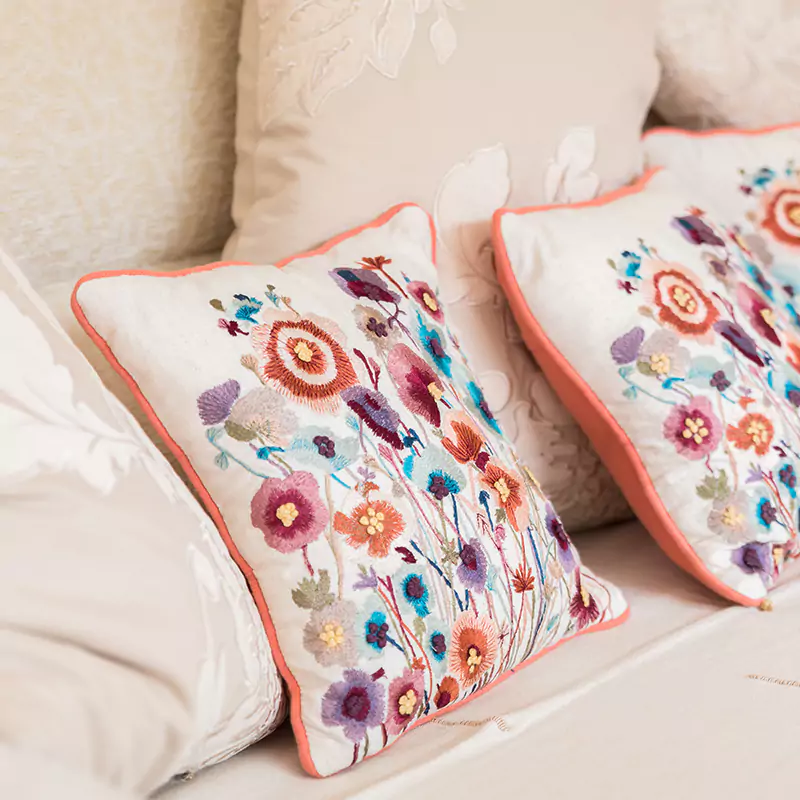 close up of embroidered cushions