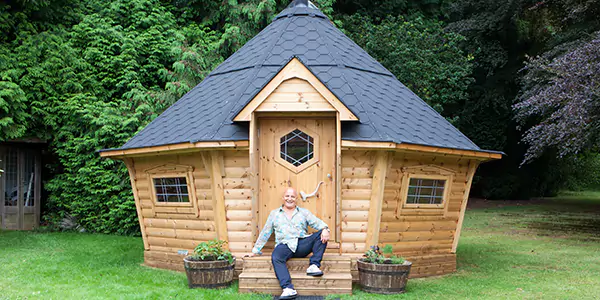 large arctic cabin with aldo zilli sat in front