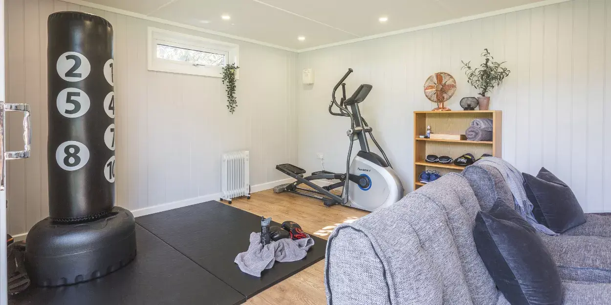 garden gym room with punchbag and exercise bike