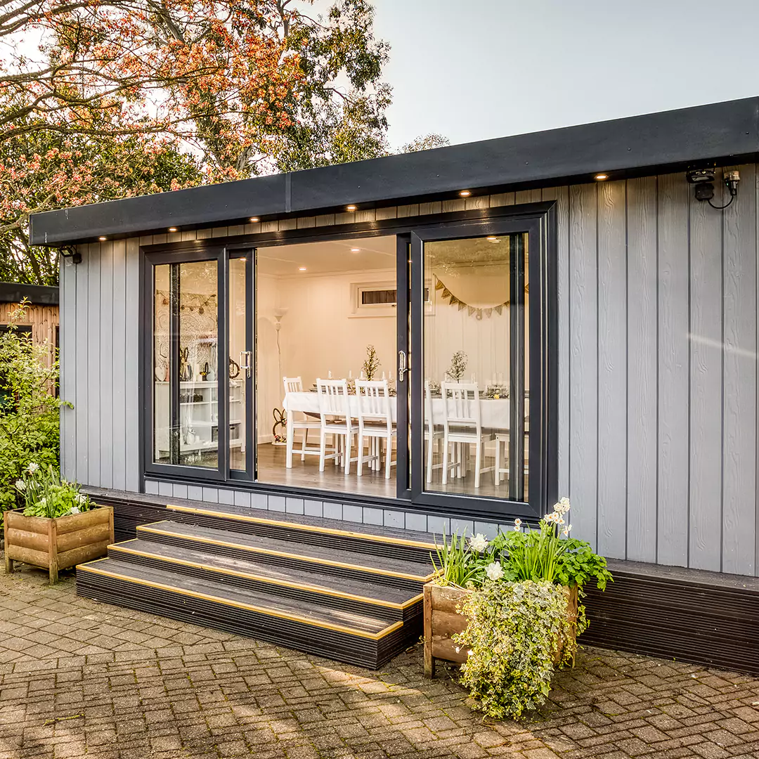 large dining room at nottingham show site with timber steps and planter in front