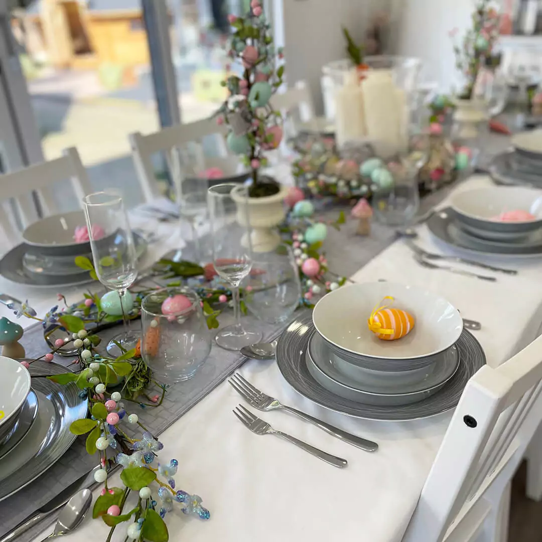 Internal view of cabin master dining room with easter decorations and zoom in of cutlery and dinner plate set 